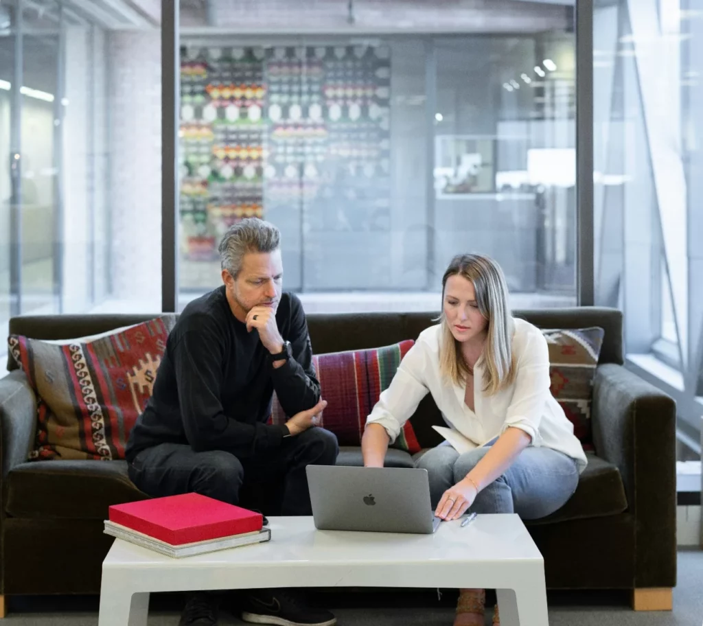 RJM team members discuss a client