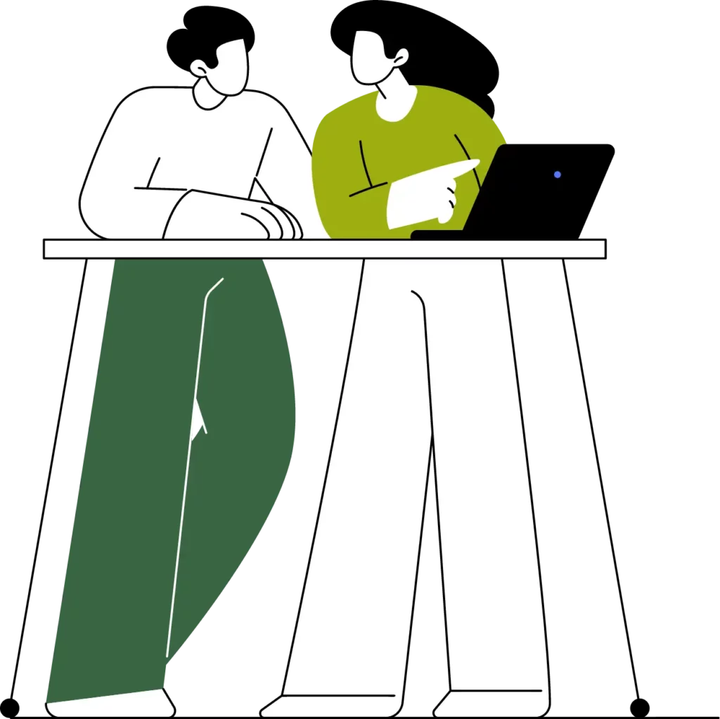 A graphic of two people standing at a desk using a laptop.