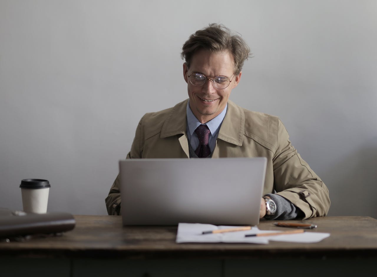 A man overseeing his Adobe Commerce account.