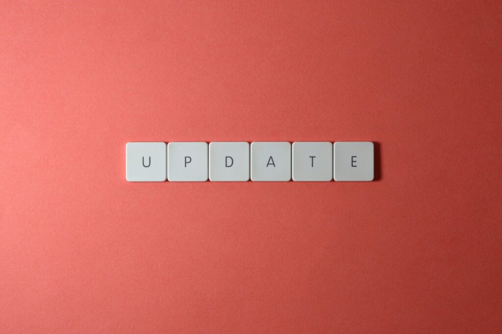 The word “UPDATE” spelled with tiles